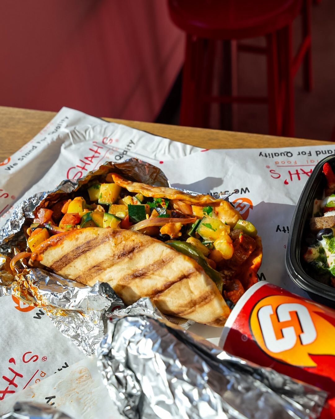 Grilled pita wrap on Shah's branded paper